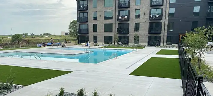 commercial synthetic turf at a pool area courtyard of an apartment complex