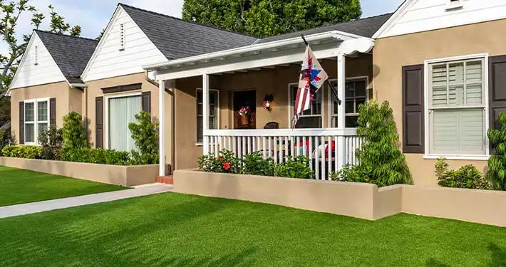 artificial grass lawn in front of pretty house