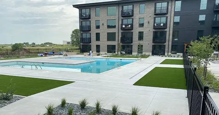 commercial synthetic turf at a pool area courtyard of an apartment complex